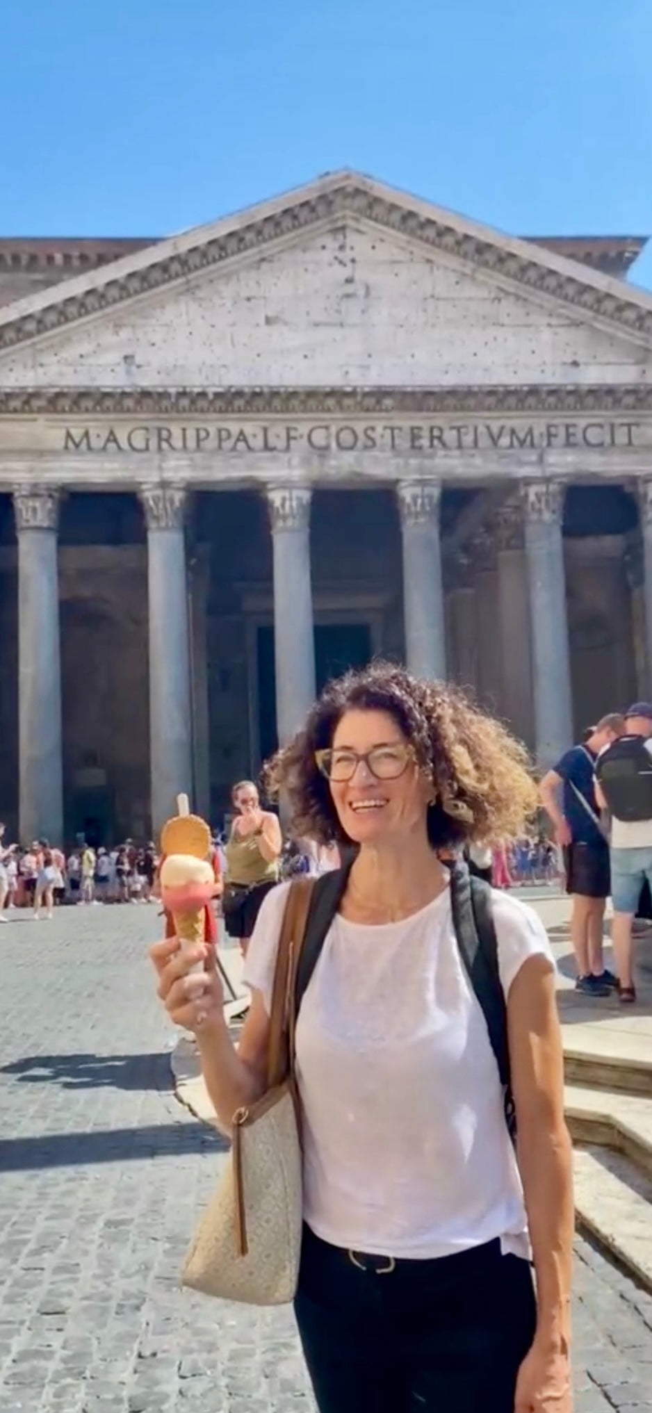 Woman with an ice cream in front of the Pantheon in Rome