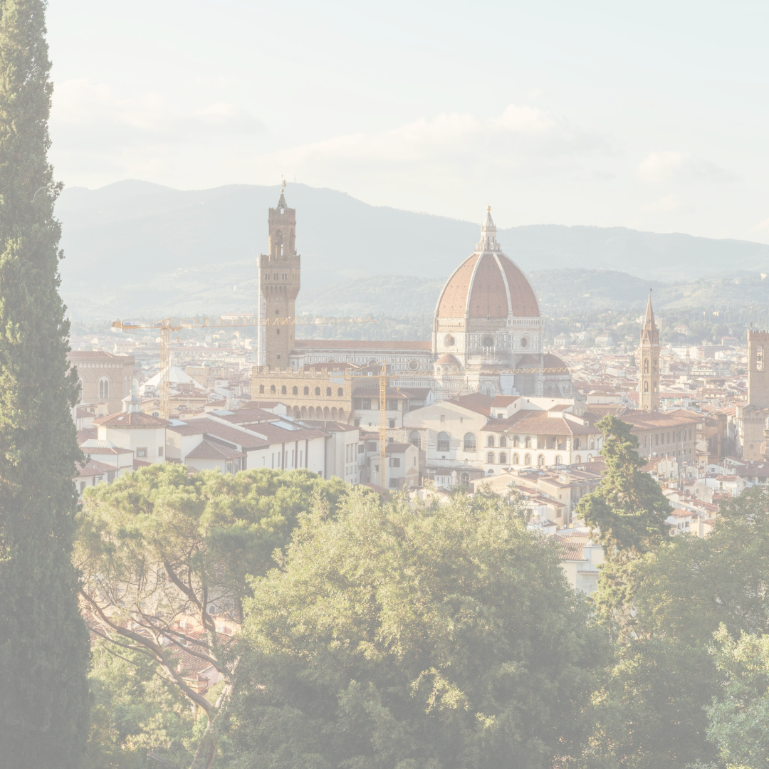 Cityscape of Florence, Italy featuring greenery and the notable Duomo monument.